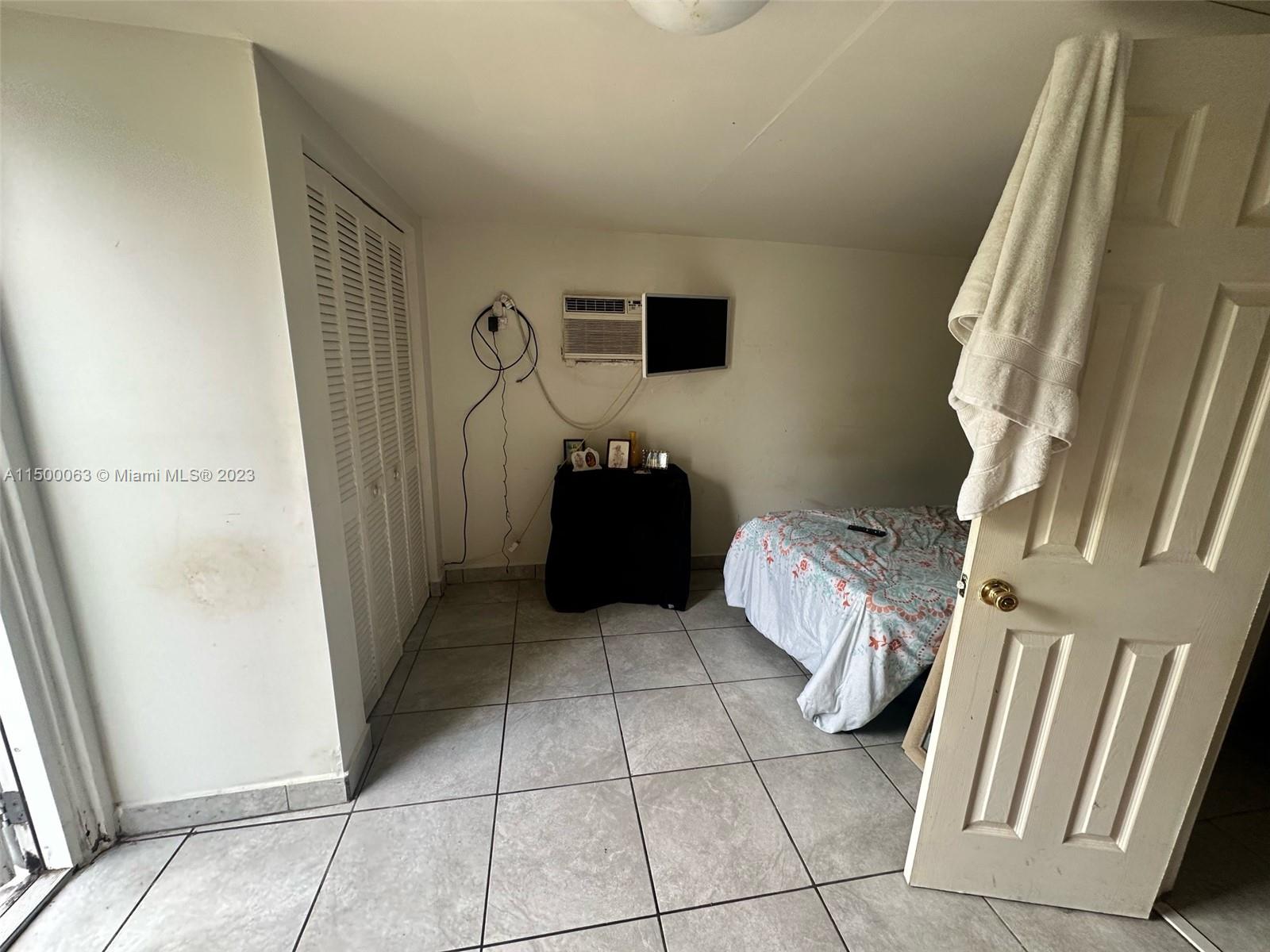 2131 Southwest 98th Place Miami, FL 33165 - Photo 17 of 22 a bathroom with a sink and a mirror