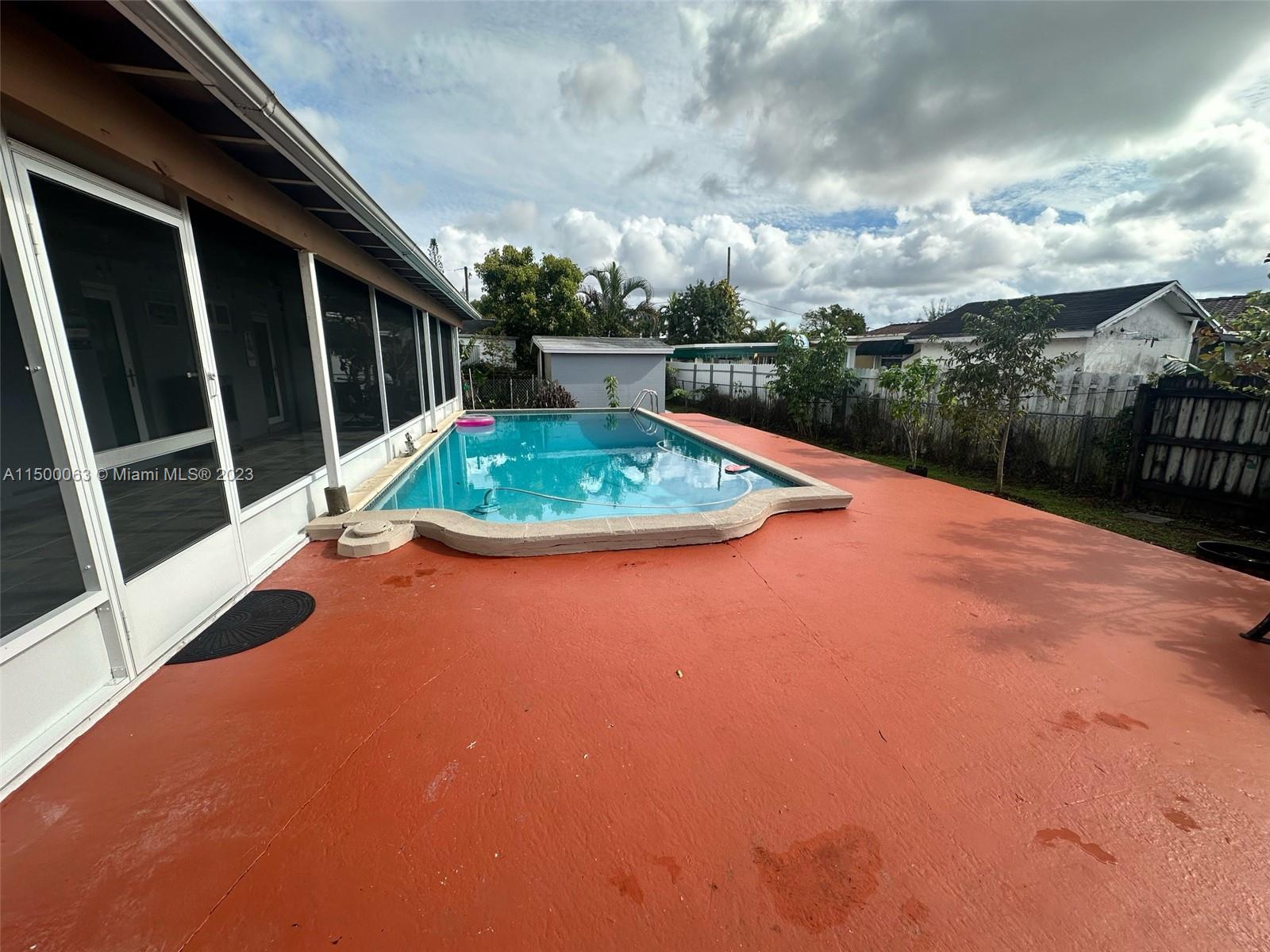 2131 Southwest 98th Place Miami, FL 33165 - Photo 19 of 22 a view of a backyard with sitting area