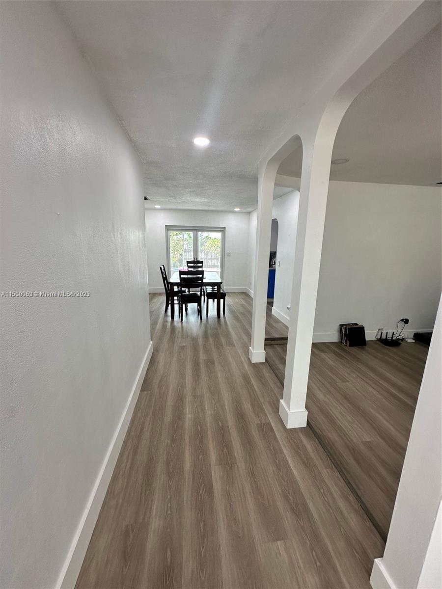 2131 Southwest 98th Place Miami, FL 33165 - Photo 4 of 22 a furnished livingroom with furniture and wooden floor