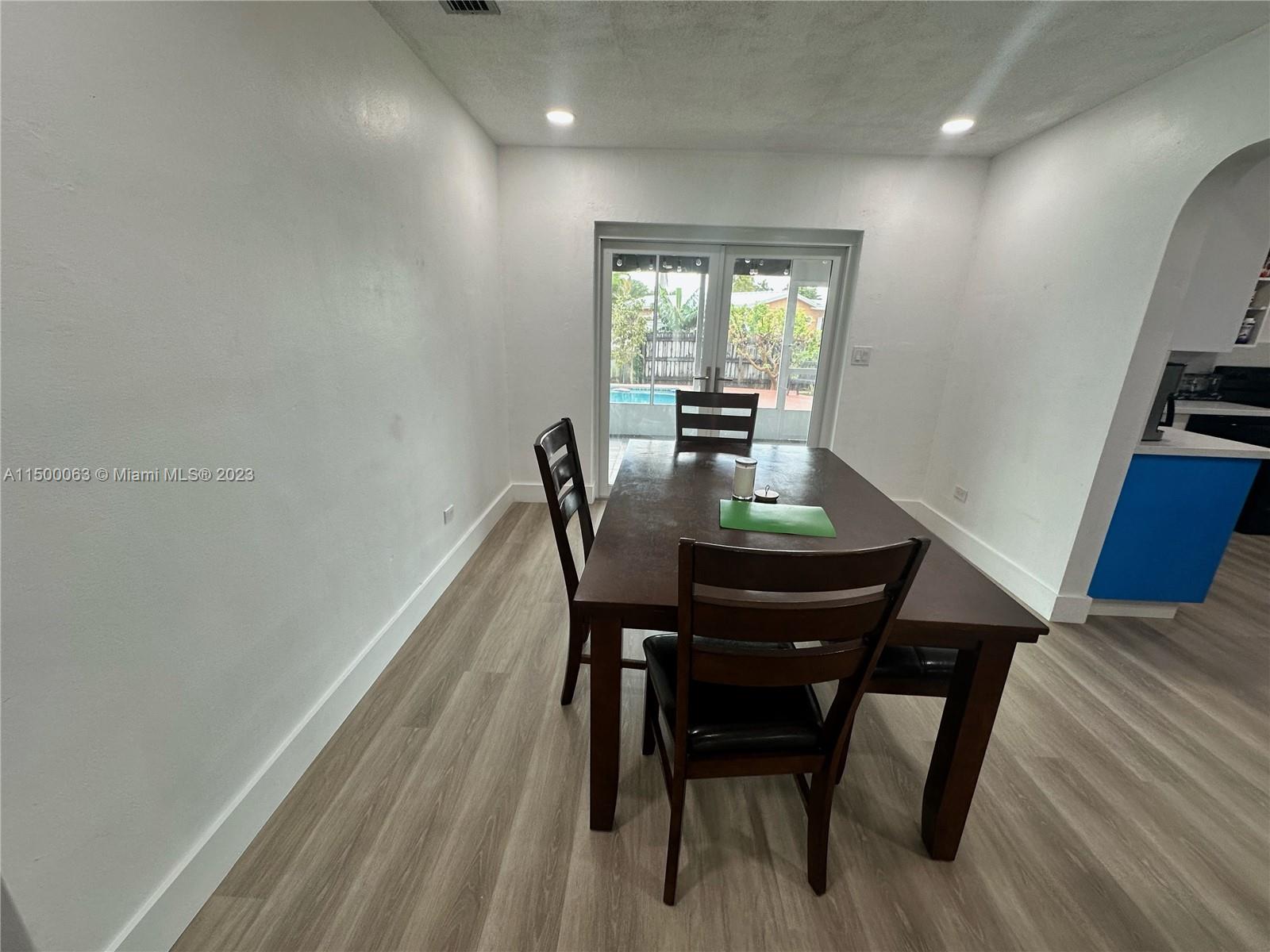 2131 Southwest 98th Place Miami, FL 33165 - Photo 7 of 22 a view of a dining room with furniture and wooden floor