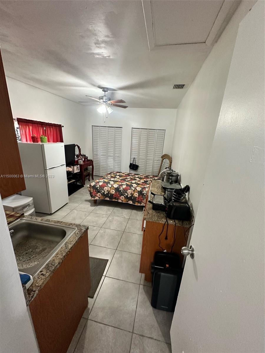 2131 Southwest 98th Place Miami, FL 33165 - Photo 8 of 22 a living room with furniture and a couch