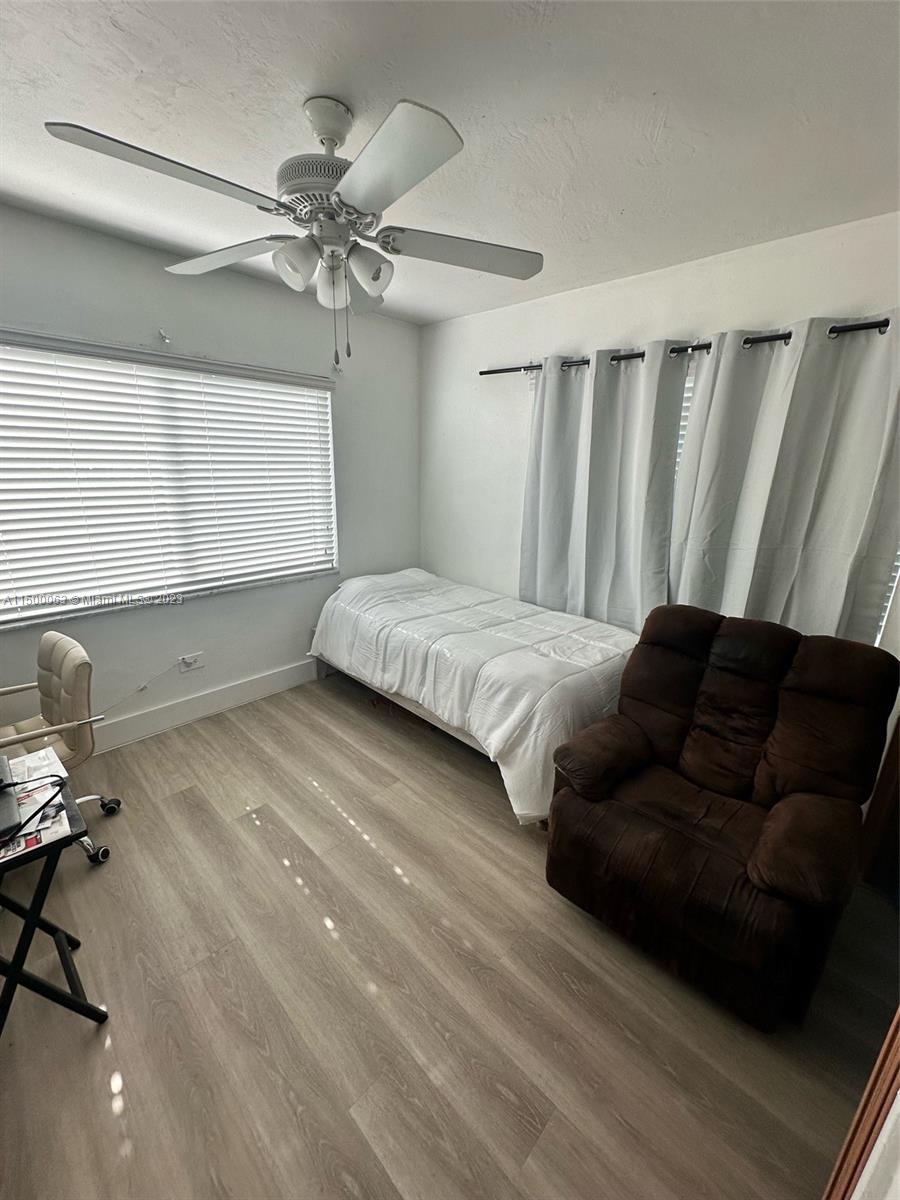 2131 Southwest 98th Place Miami, FL 33165 - Photo 9 of 22 a bedroom with a bed and window