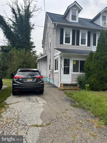 a car parked in front of a house