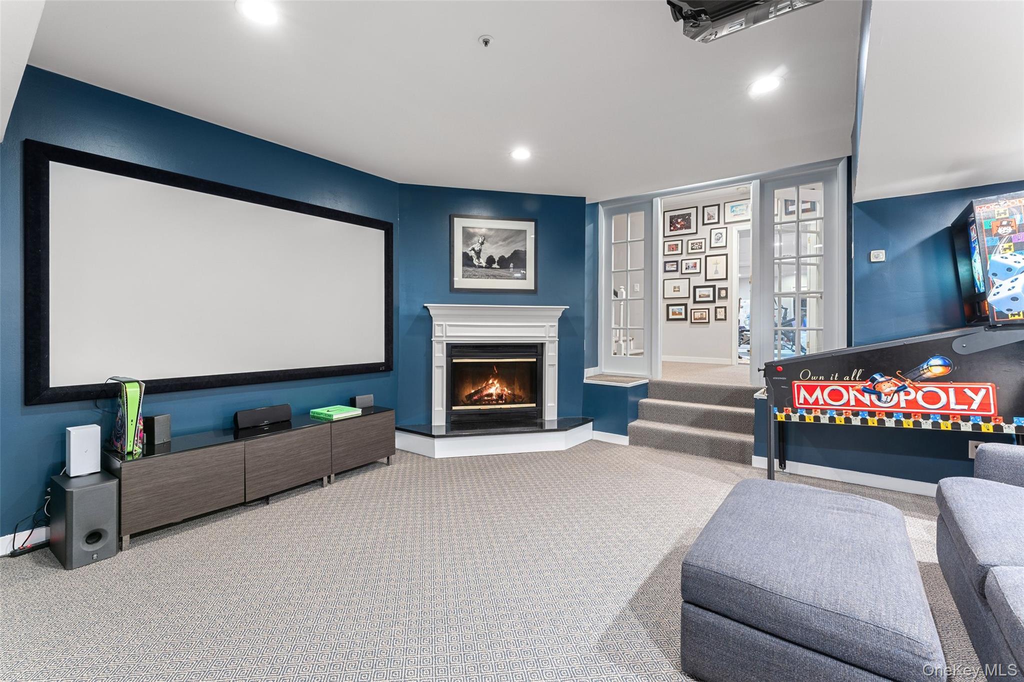 227 Boulder Ridge Road Scarsdale, NY 10583 - Photo 24 of 37 Lower level home theatre/den with fire place