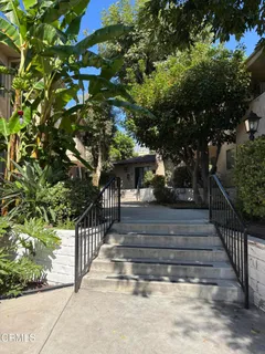 a view of house with a yard