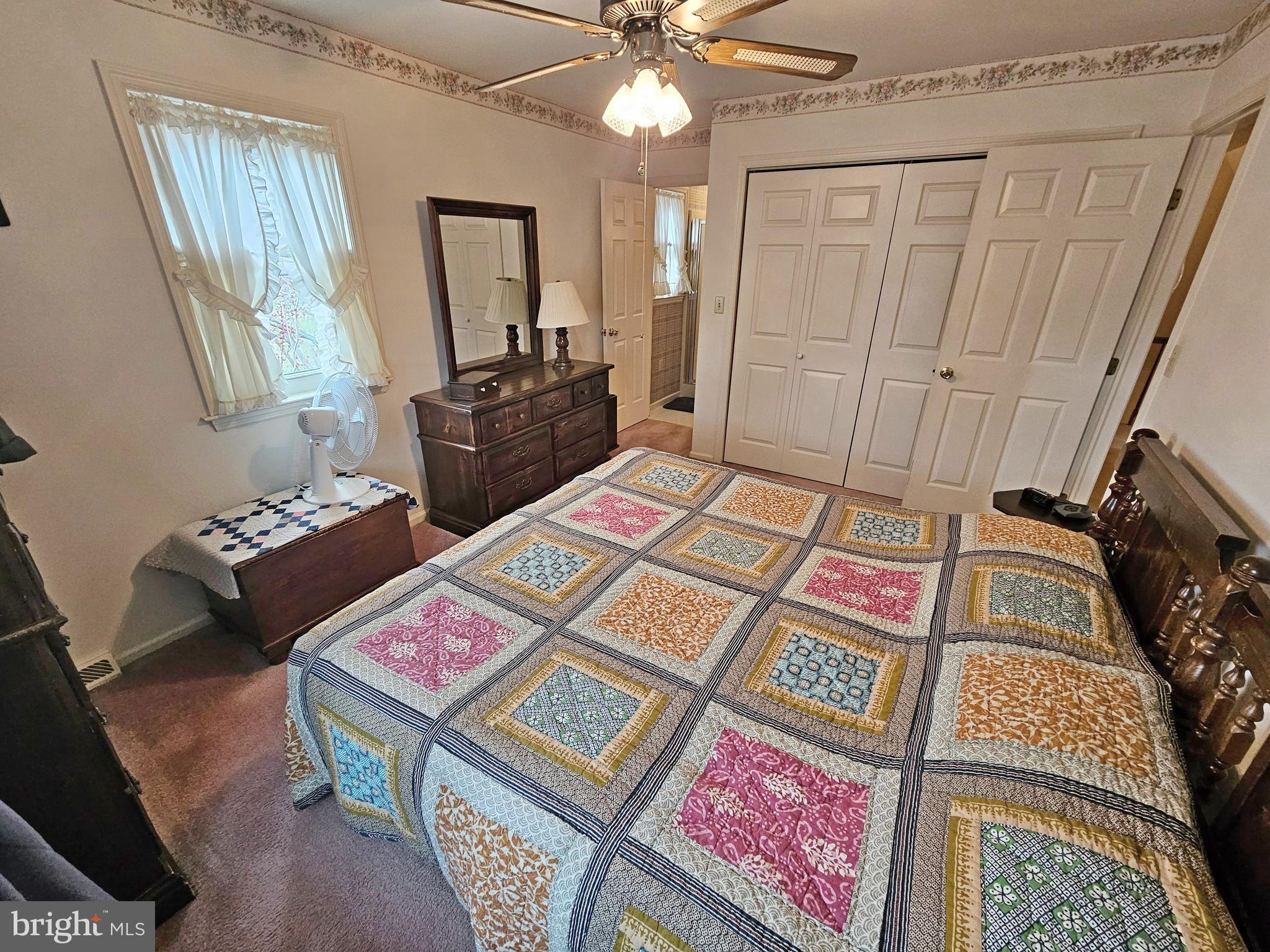 402 Snyder Hill Road Lititz, PA 17543 - Photo 23 of 35 a bedroom with a bed and a chandelier