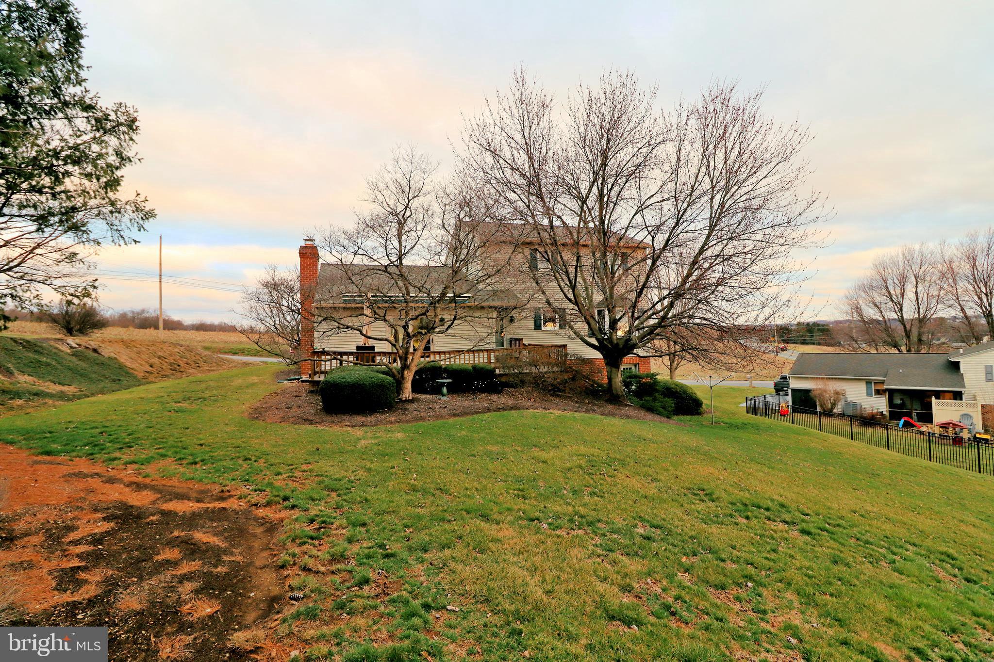 402 Snyder Hill Road Lititz, PA 17543 - Photo 3 of 35 a view of a house with a big yard and large trees