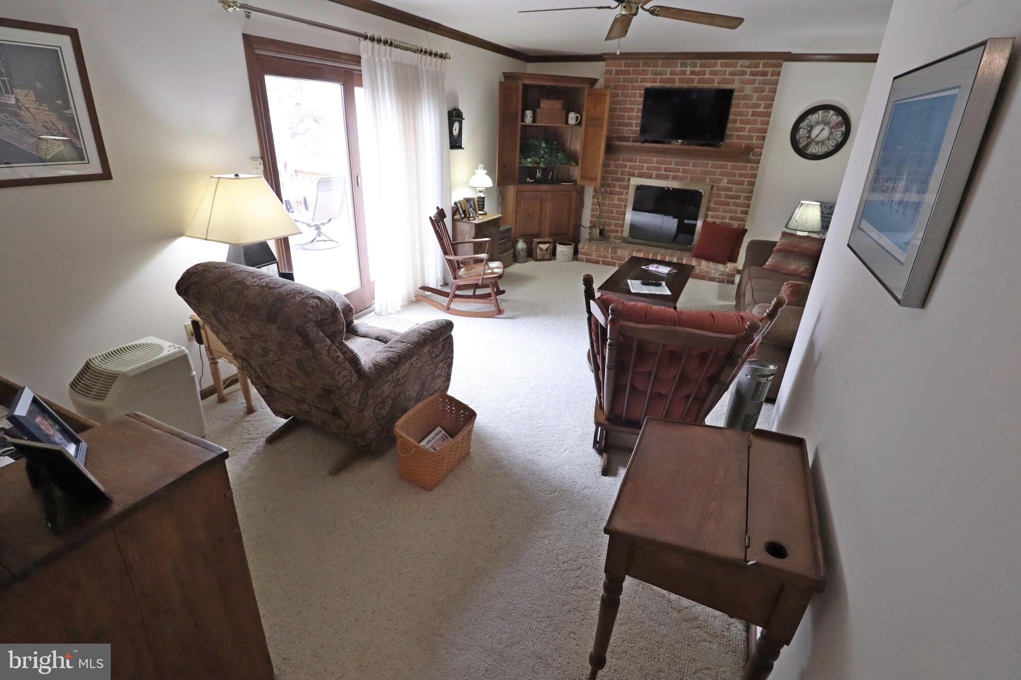 402 Snyder Hill Road Lititz, PA 17543 - Photo 7 of 35 a living room with furniture and a fireplace