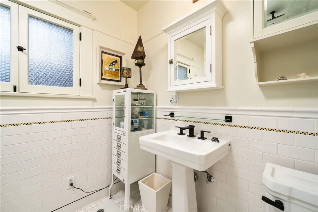 335 Harvard Avenue North Claremont, CA 91711 - Photo 19 of 71 a bathroom with a sink and a mirror