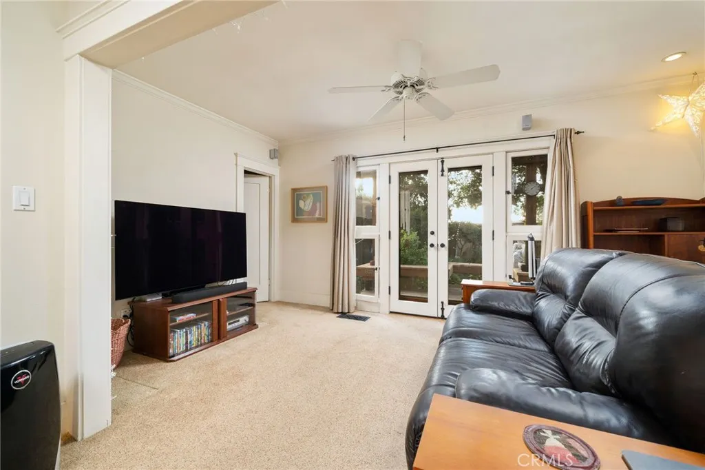 335 Harvard Avenue North Claremont, CA 91711 - Photo 21 of 71 a living room with furniture and a flat screen tv