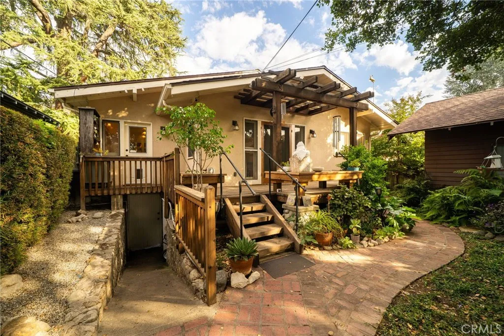 335 Harvard Avenue North Claremont, CA 91711 - Photo 24 of 71 a view of a house with a small yard and wooden fence