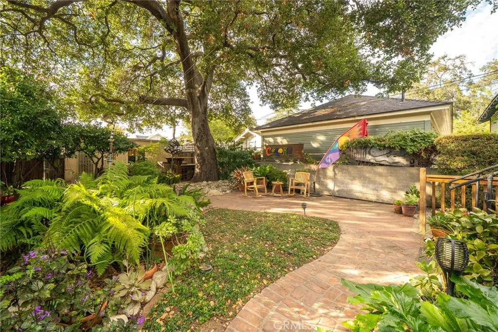 335 Harvard Avenue North Claremont, CA 91711 - Photo 30 of 71 a view of a patio with table and chairs and potted plants
