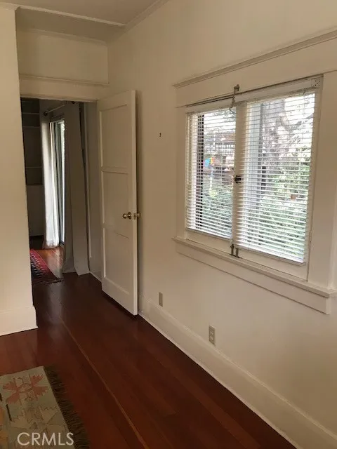 335 Harvard Avenue North Claremont, CA 91711 - Photo 45 of 71 a view of an empty room with wooden floor and a window