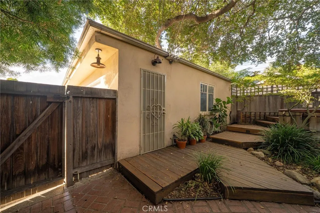 335 Harvard Avenue North Claremont, CA 91711 - Photo 52 of 71 a view of backyard with potted plants and wooden fence