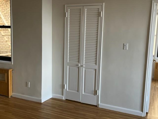 200 Corbin Place, Unit 2H Brooklyn, NY 11235 - Photo 11 of 18 a view of wooden floor