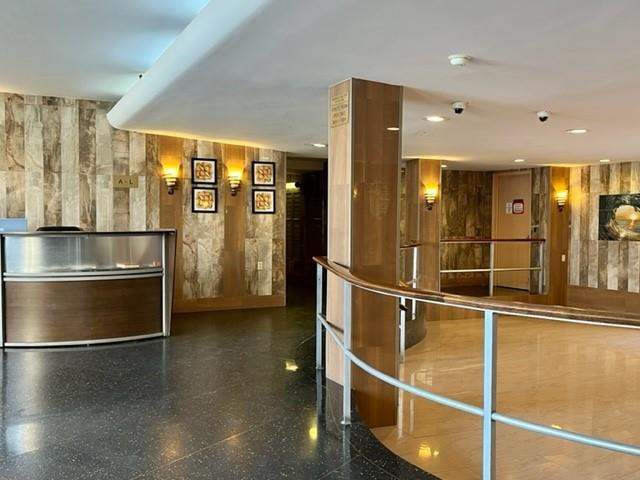200 Corbin Place, Unit 2H Brooklyn, NY 11235 - Photo 14 of 18 a view of a refrigerator in kitchen and an empty room