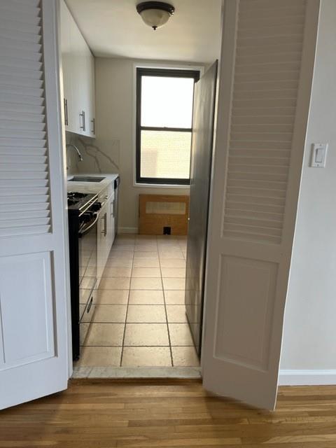 200 Corbin Place, Unit 2H Brooklyn, NY 11235 - Photo 4 of 18 a view of an empty room with a window