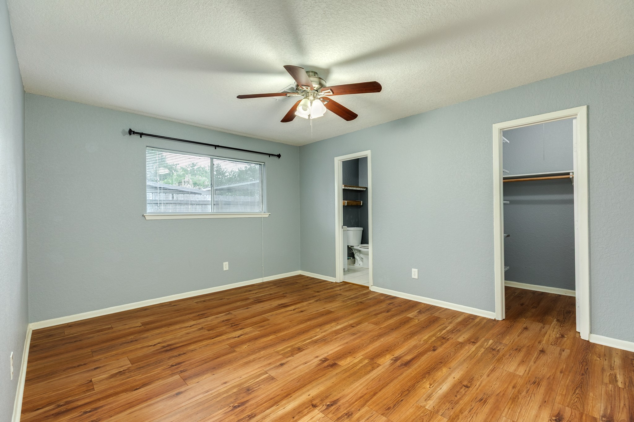 128 Houston Street Angleton, TX 77515 - Photo 19 of 25 a view of empty room with wooden floor