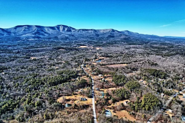 a kitchen with a refrigerator and a stove