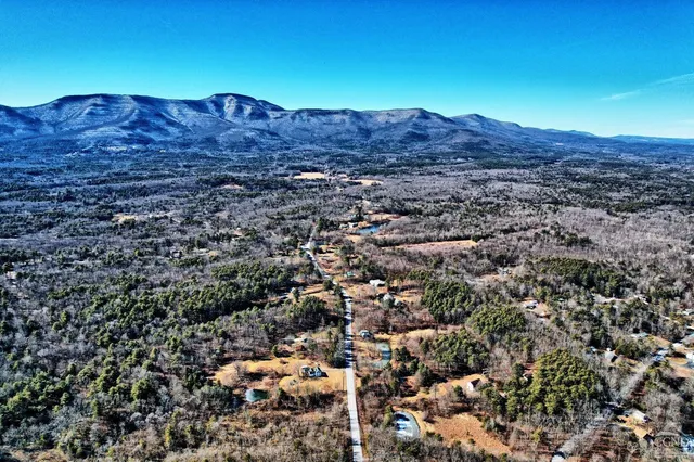 a kitchen with a refrigerator and a stove