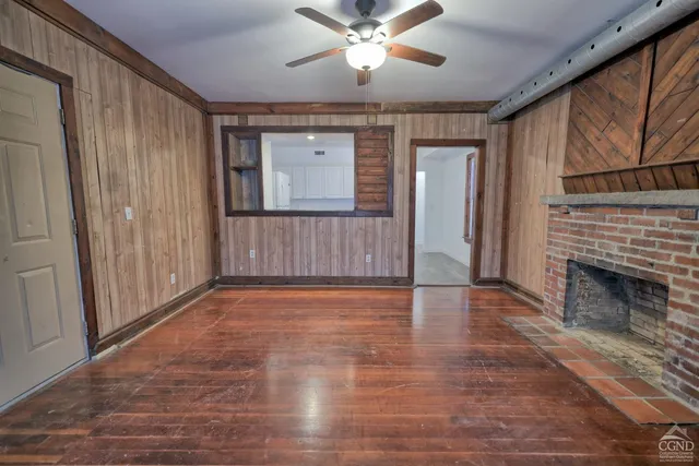 a bedroom with bed and a window