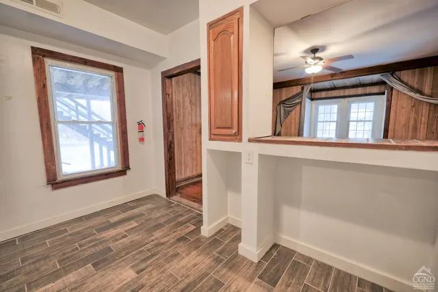 a kitchen with stainless steel appliances a stove top oven a sink dishwasher and a refrigerator