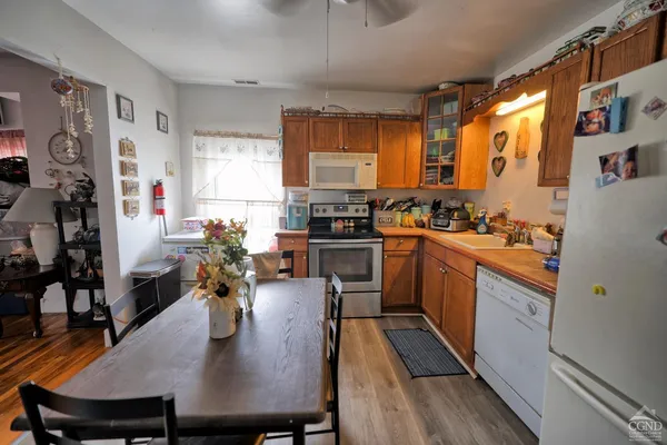 a bathroom with a toilet and a shower curtain