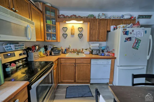 a bedroom with a bed and a table in it