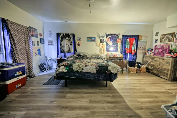 a front view of a house with a garden and deck