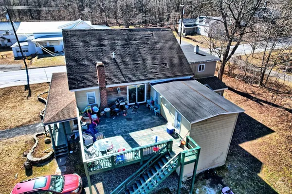 a kitchen with granite countertop white cabinets and a stove