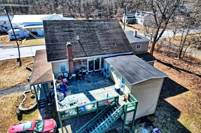 a kitchen with granite countertop white cabinets and a stove