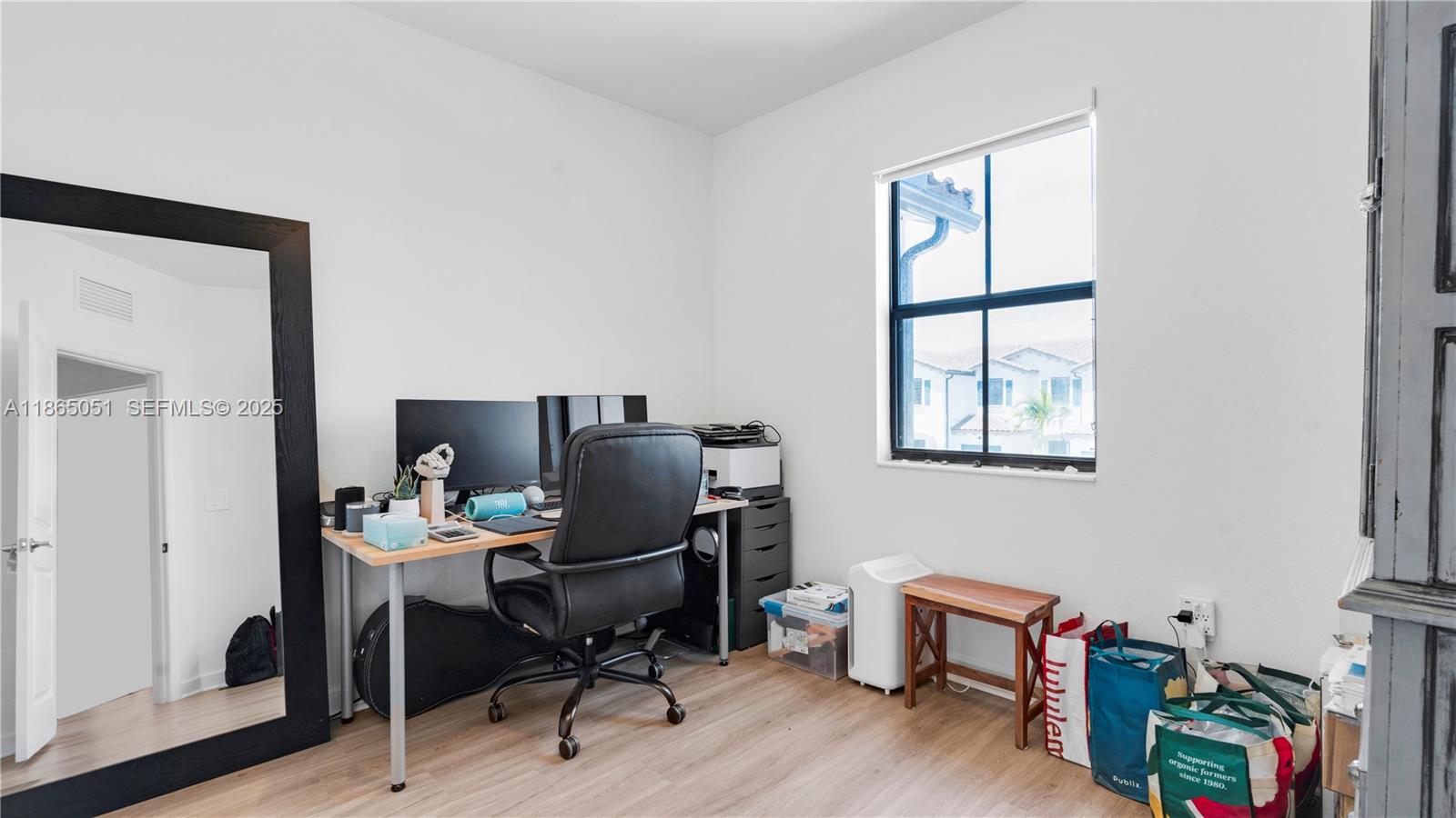11922 Southwest 245 Terrace Homestead, FL 33032 - Photo 22 of 31 a view of a workspace with furniture and a window
