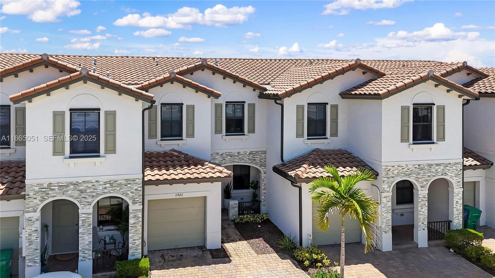 11922 Southwest 245 Terrace Homestead, FL 33032 - Photo 27 of 31 a front view of a house with a yard