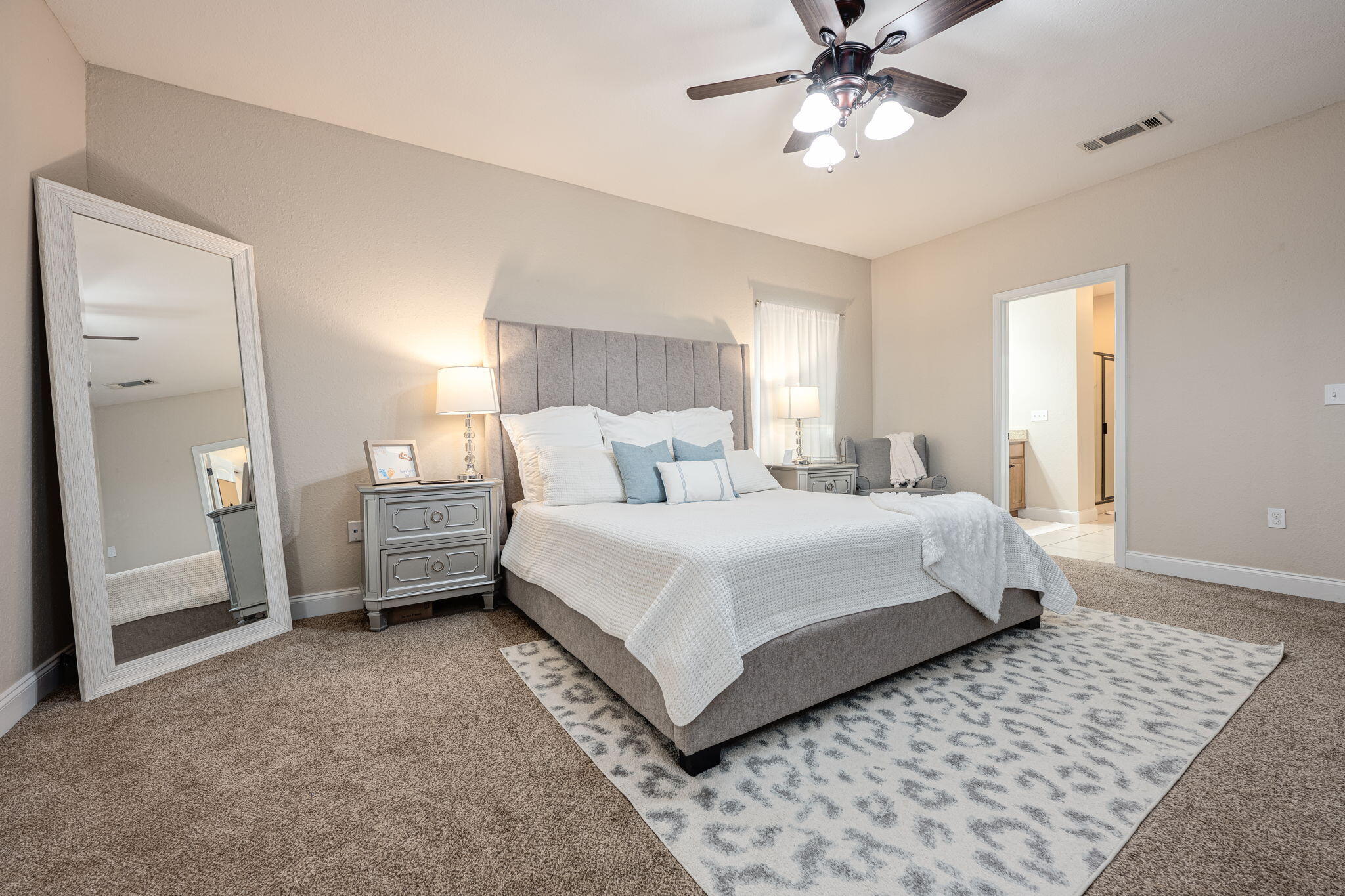 4591 Hermosa Road Crestview, FL 32539 - Photo 23 of 59 a bedroom with a bed and a chandelier