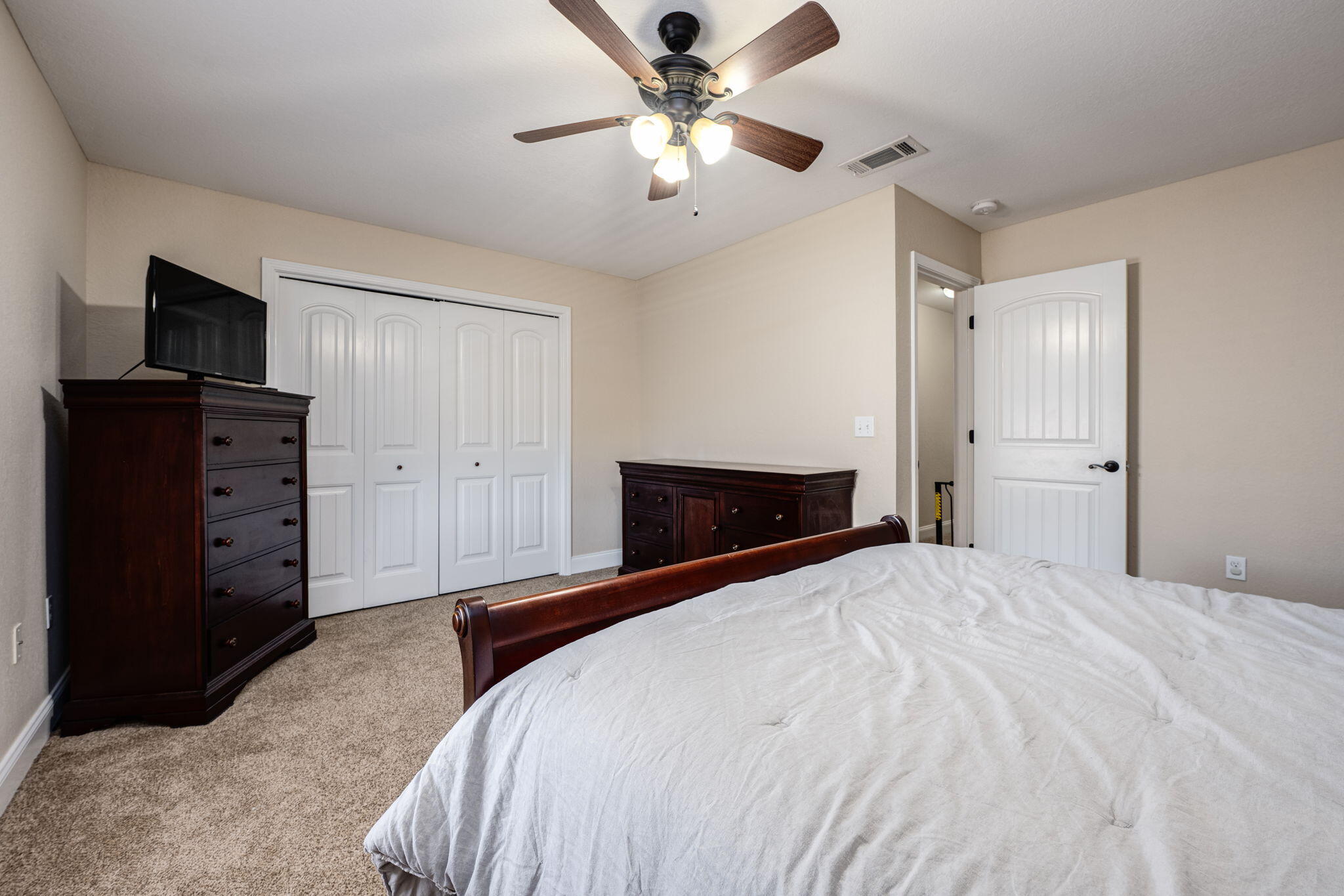 4591 Hermosa Road Crestview, FL 32539 - Photo 46 of 59 a bedroom with a bed and a television