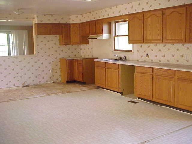 101 Board Mountain Road Goodview, VA 24095 - Photo 2 of 4 a kitchen with granite countertop a sink and a stove