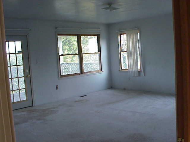 101 Board Mountain Road Goodview, VA 24095 - Photo 4 of 4 an empty room with windows