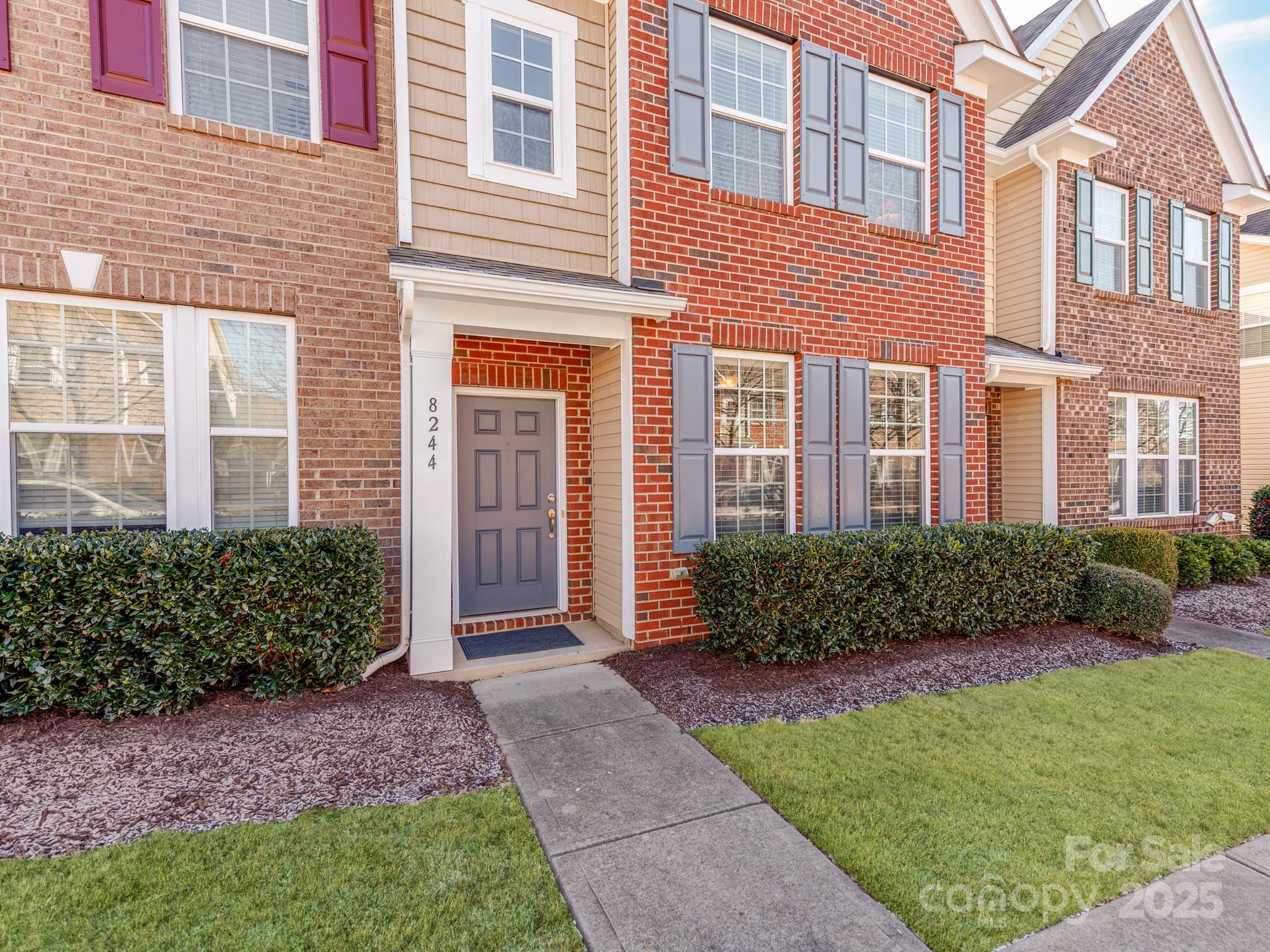 8244 Viewpoint Lane Cornelius, NC 28031 - Photo 3 of 33 a front view of a house with garden