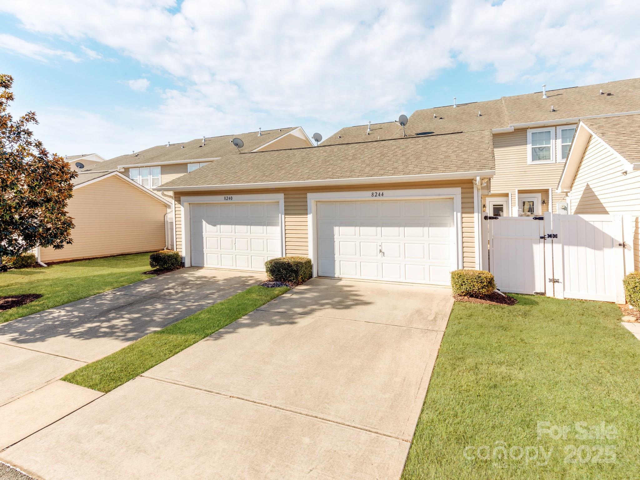 8244 Viewpoint Lane Cornelius, NC 28031 - Photo 31 of 33 a front view of a house with a yard and garage
