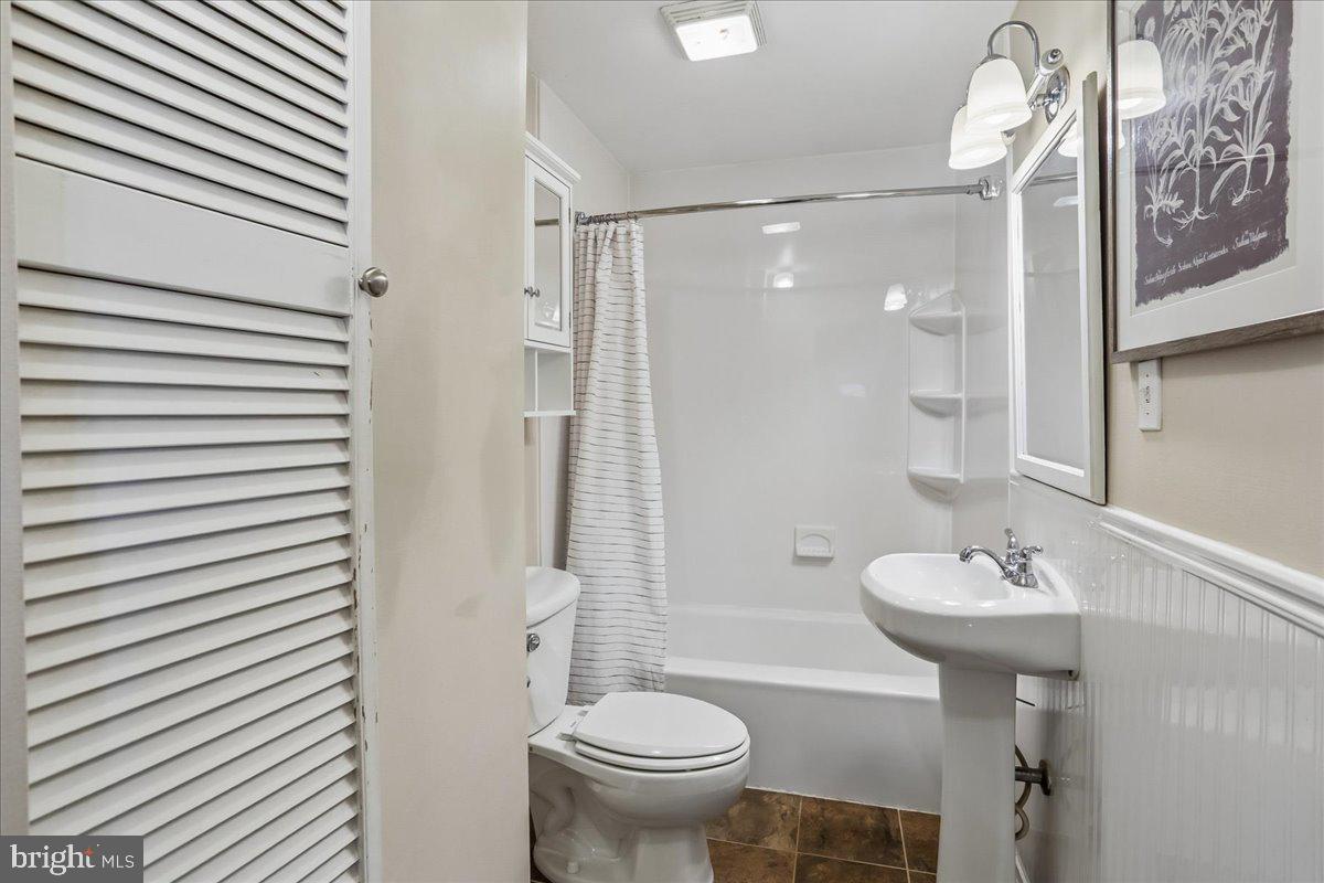 22325 Nicholson Farm Road Dickerson, MD 20842 - Photo 10 of 32 a bathroom with a sink toilet and shower