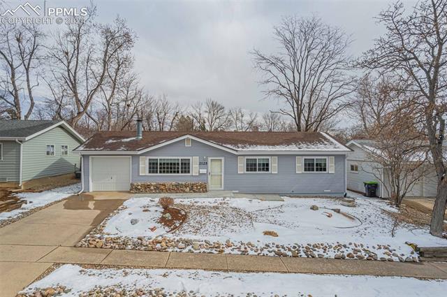 2125 Winston Road Colorado Springs, CO 80909 - Photo 33 of 37 Ranch-style house with a garage