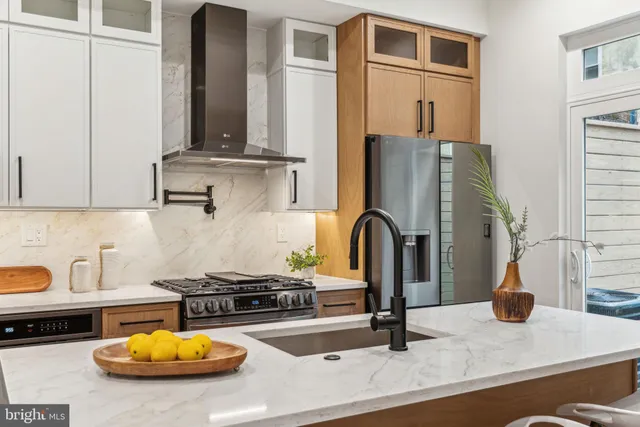 a living room with furniture and large window