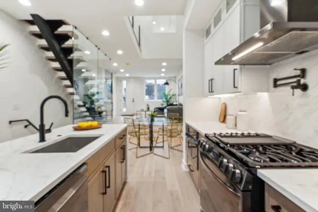 a bedroom with furniture and a painting on the wall