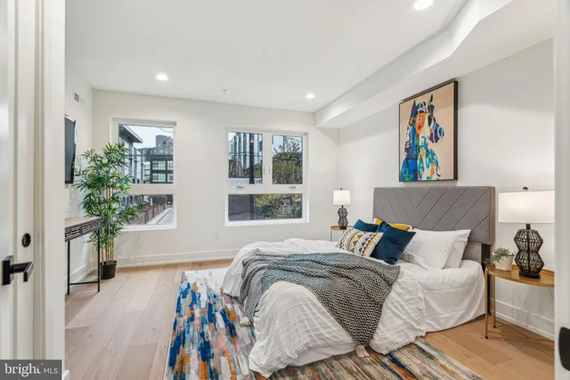 a bathroom with a sink mirror toilet and vanity
