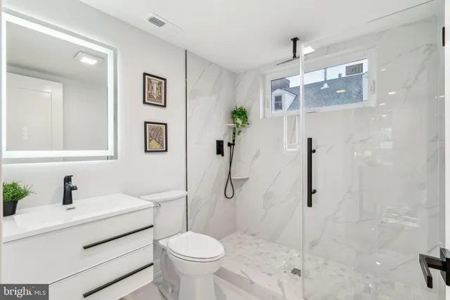 a white bath tub sitting next to a window