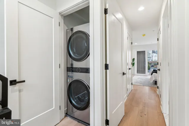 a bedroom with a bed and painting on the wall