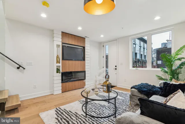 a view of kitchen with furniture and wooden floor