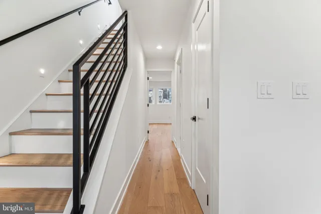 a white toilet sitting next to a bathroom sink