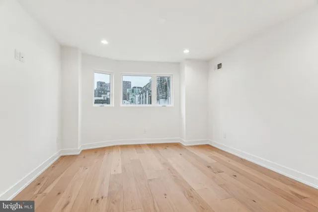 an aerial view of a house with a yard wooden table and chairs
