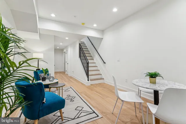 a couple of cars parked in front of brick building